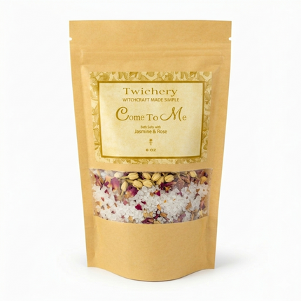 Kraft paper pouch of Twichery Come To Me Bath Salts on a white background, with herbal bath salts visible through the window and a golden label displaying the Twichery Authenticity Sigil.