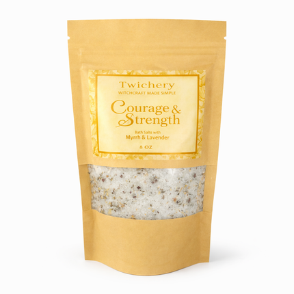 Kraft paper pouch of Twichery Courage & Strength Bath Salts on a white background, with herbal bath salts visible through the window and a golden label displaying the Twichery Authenticity Sigil.
