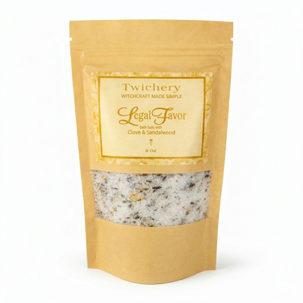 Kraft paper pouch of Twichery Legal Favor Bath Salts on a white background, with herbal bath salts visible through the window and a golden label displaying the Twichery Authenticity Sigil.