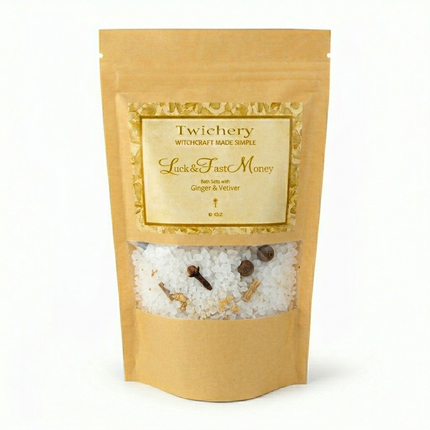 Kraft paper pouch of Twichery Luck & Fast Money Bath Salts on a white background, with herbal bath salts visible through the window and a golden label displaying the Twichery Authenticity Sigil.
