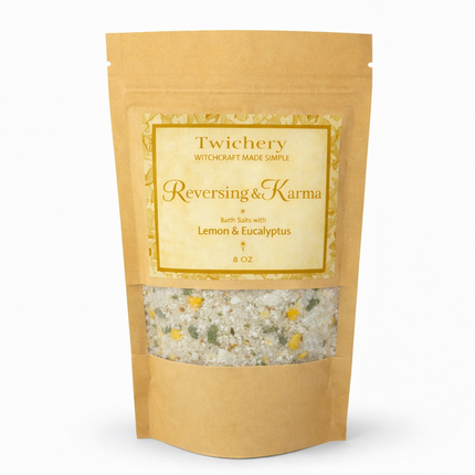 Kraft paper pouch of Twichery Reversing & Karma Bath Salts on a white background, with herbal bath salts visible through the window and a golden label displaying the Twichery Authenticity Sigil.