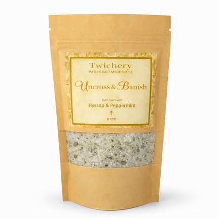 Kraft paper pouch of Twichery Uncross & Banish Bath Salts on a white background, with herbal bath salts visible through the window and a golden label displaying the Twichery Authenticity Sigil.