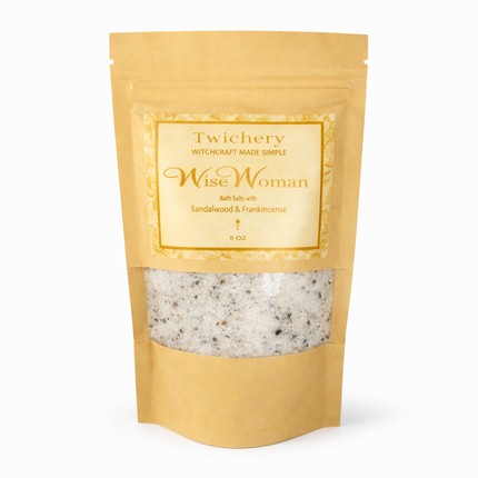 Kraft paper pouch of Twichery Wise Woman Bath Salts on a white background, with herbal bath salts visible through the window and a golden label displaying the Twichery Authenticity Sigil.