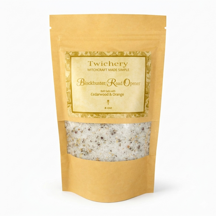 Kraft paper pouch of Twichery Blockbuster/Road Opener Bath Salts on a white background, with herbal bath salts visible through the window and a golden label displaying the Twichery Authenticity Sigil.