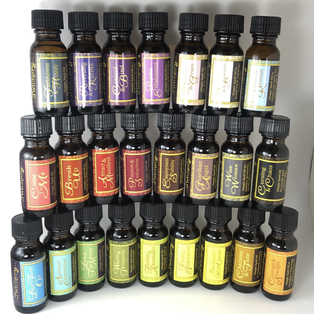 Twichery Quikspell Oils for Courage & Strength are beautifully collectible! Wise Woman Oil pictured with all other Twichery Quikspell Oils! Hoodoo, Voodoo, Wicca, Pagan
